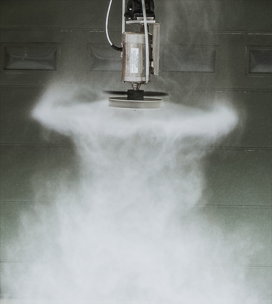 Tornado unit operating with a visible curtain of mist